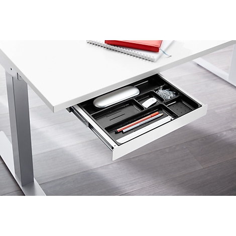 White desk with an open drawer. Contains a mouse, pens, and paper clips.