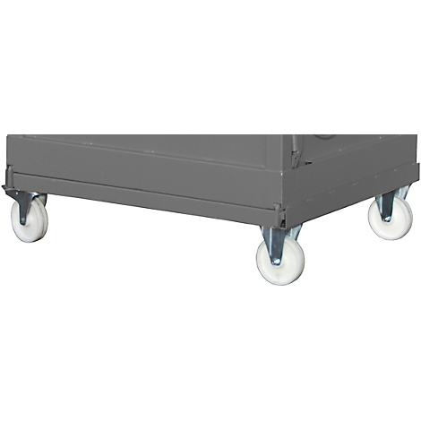 Close-up of four white casters under a gray cabinet. The casters are metal-mounted.