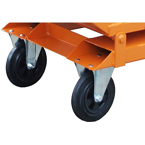 Two black wheels on an orange metal frame, close-up.