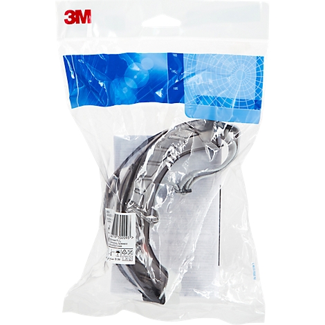 Schutzbrille in Plastikverpackung. Schwarzes Gestell, transparente Gläser, Marke 3M.