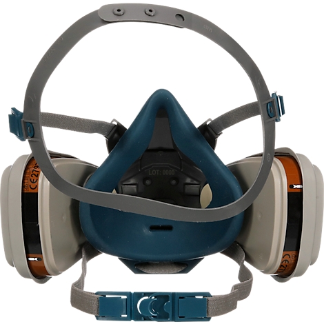 Gros plan d'un masque respiratoire. Il se compose de plastique bleu, de filtres gris et de sangles.