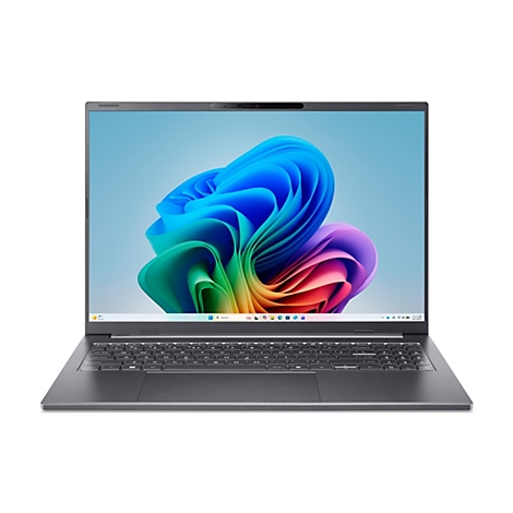 Dunkelgrauer Acer Laptop mit schmalem Rahmen, zeigt das bunte Windows 11 Hintergrundbild.