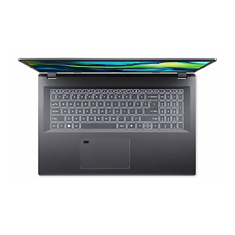 Draufsicht auf einen geöffneten Laptop mit beleuchteter Tastatur auf weißem Hintergrund.