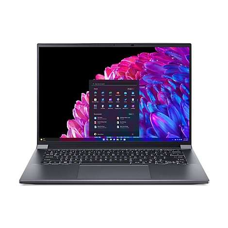 Dunkelgraues Laptop, Display mit Windows-Oberfläche. Auf dem Bildschirm ein Fenster mit App-Symbolen.