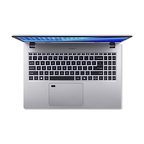 Draufsicht auf ein silberfarbenes Laptop-Keyboard mit geöffnetem Bildschirm. Auf dem Bildschirm ist ein blaues Muster zu sehen. Die Tastatur hat weiße Schriftzeichen und einen Trackpad.