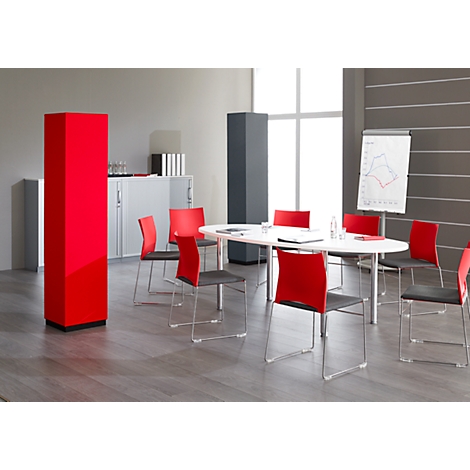 Conference room with red pillar, oval table, chairs and flipchart. Inviting atmosphere.