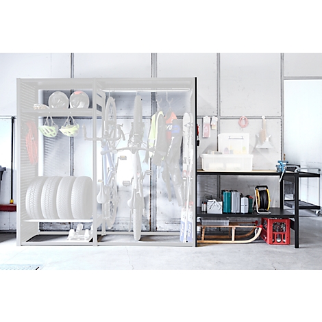Spacious shelf and storage cabinet with sports equipment, tires, and tools. Bright, modern design.