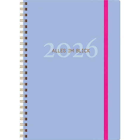 Cahier bleu clair avec reliure à spirale et marque-page rose. L'avant indique l'année 2026 et "TOUT EN VUE".