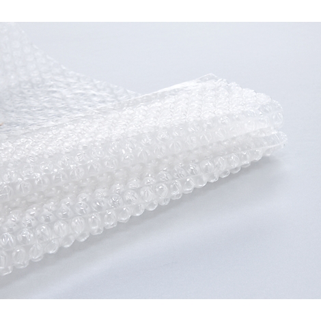 Stack of transparent bubble wrap on a white background.