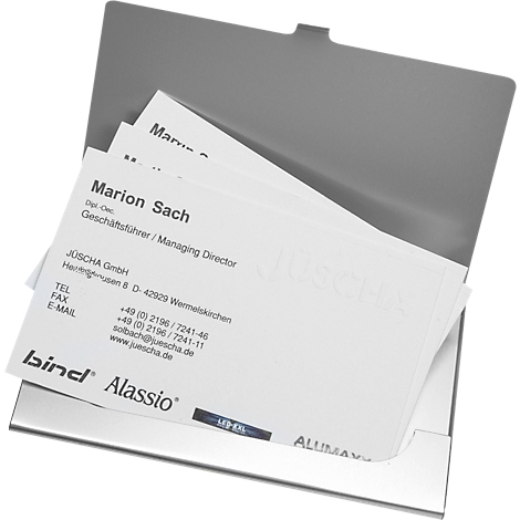 Metal business card holder filled with business cards. One card says: Marion Sach, Managing Director.