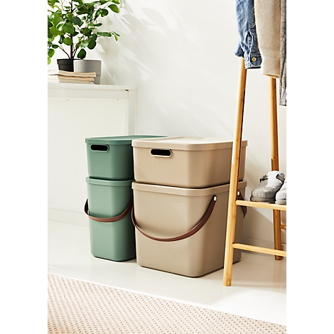 Two stackable green and beige storage boxes with lids, handles and grips.