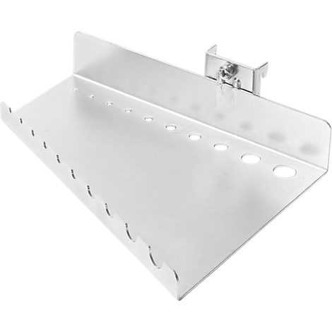 Bright metal tool holder with holes. The holder shows openings and recesses of different sizes.