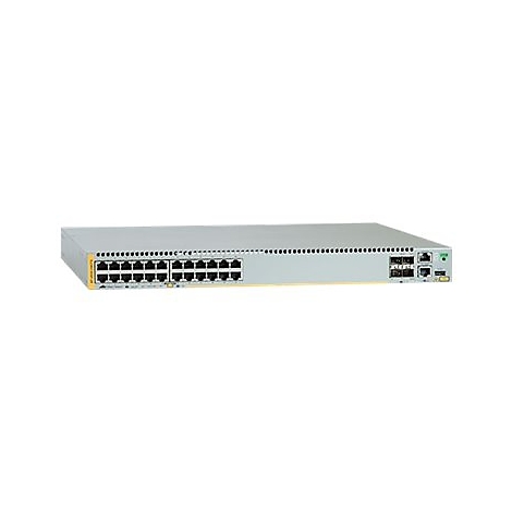 Ein grauer Netzwerk-Switch mit vielen Ports und Anschlüssen, vor weißem Hintergrund.
