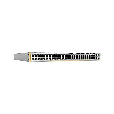 Ein grauer Netzwerk-Switch mit vielen Ports vor weißem Hintergrund. Gelbe Details.