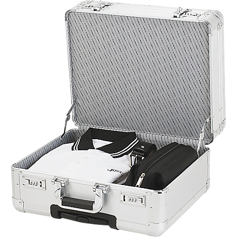Opened silver suitcase with white polo shirt, black belt and black toiletry bag.