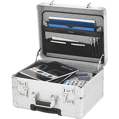 Silver briefcase open. Inside: folders, pens, books and a calculator. The case has combination locks.