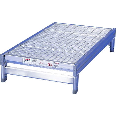 Aluminum work platform. A silver, rectangular platform with a perforated surface, standing on four legs.