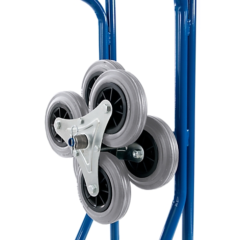 Close-up of the stair climbing wheels of a blue hand truck. Grey wheels are attached to a silver bracket.
