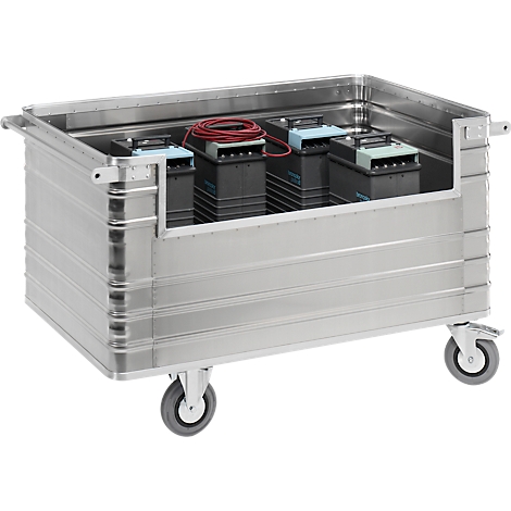 Silver transport box on wheels, filled with batteries and cables.