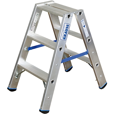 A three-step aluminum step ladder of the brand Krause, on a white background.