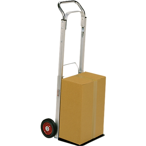 A silver hand truck transporting a cardboard box. A red wheel is visible.
