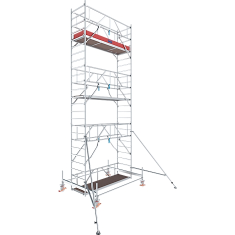 Tall, silver scaffolding with multiple levels and platforms. A red element is visible. The scaffolding stands on wheels.