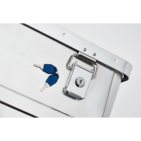 Close-up of a silver metal box with a key and lock.