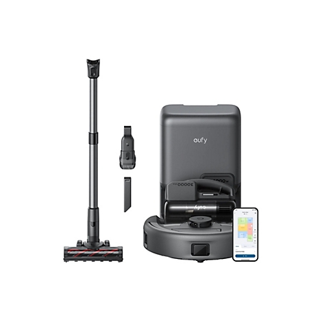 Ein grauer Staubsauger mit Zubehör und Ladestation. Auf einem Smartphone ist eine App mit Raumaufteilung zu sehen.