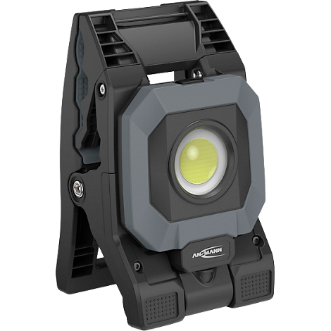 Donkergrijze werklamp, hoekig, met LED-verlichting. De naam "AKKU-MANN" is aan de voorkant te zien.