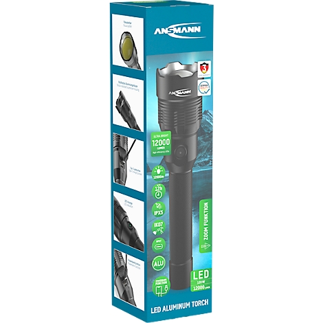 A black LED torch on a packaging box with technical details and product information. On top is 'ANSMANN' with the logo.