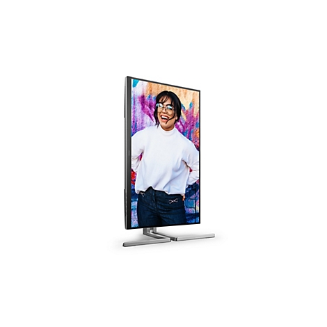 Monitor mit Person, die vor einer Graffiti-Wand steht, auf dem Bildschirm.