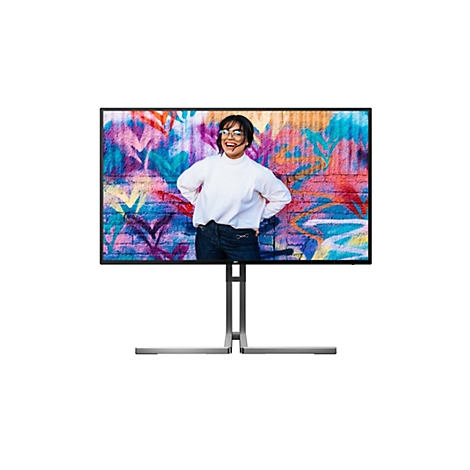Ein Monitor mit einer Frau, die auf einem Graffiti-Hintergrund lächelt.