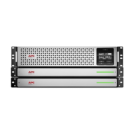 Graues APC-USV-Gerät mit Digitalanzeige. Aufschrift APC, Anzeige zeigt 230 V an. Grün leuchtende Balken.