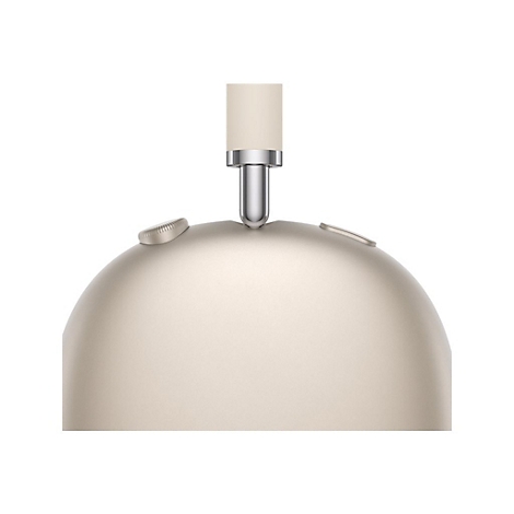 Gros plan d'un casque doré. Un bandeau beige en haut, relié à une articulation métallique. Deux boutons sont sur l'écouteur.
