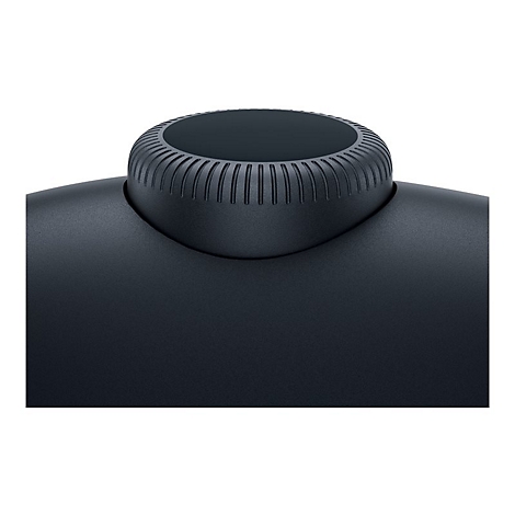 Gros plan d'un objet noir avec un dessus strié. La surface est mate.