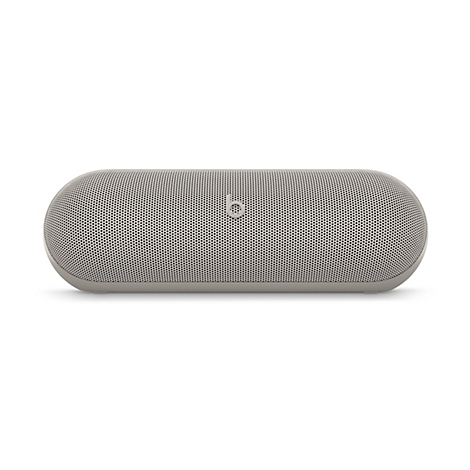 Beige, zylinderförmiger Bluetooth-Lautsprecher von Beats mit mittigem Logo vor weißem Hintergrund.