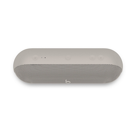 Beige, zylindrischer Bluetooth-Lautsprecher in Draufsicht mit Tasten für Lautstärke und Power sowie Beats-Logo.