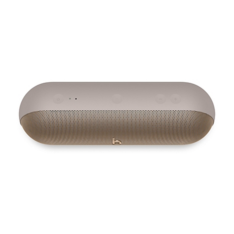 Beige Bluetooth-Lautsprecher auf weißem Hintergrund, ovale Form, Metallgitter, Bedienelemente.