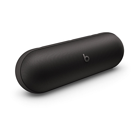 Haut-parleur Beats noir, oblong, avec une surface perforée. Le logo "b" est visible.