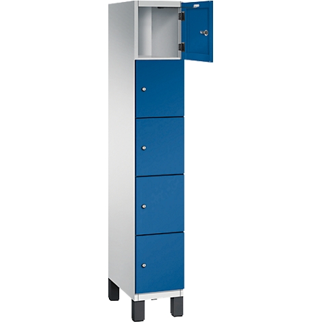 Une armoire avec quatre portes bleues et une porte ouverte. La porte a une charnière.