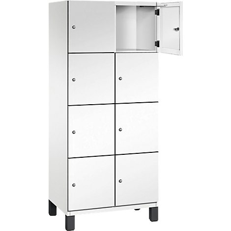 Casier blanc avec huit compartiments, un compartiment ouvert.