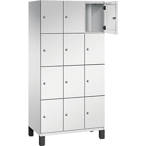 Casier blanc avec 12 compartiments, une porte est ouverte.