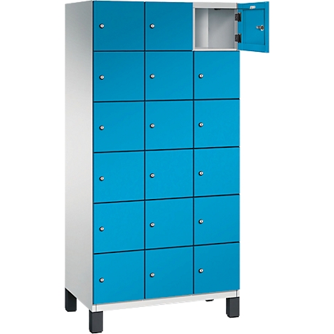 Casier bleu avec plusieurs compartiments, un compartiment ouvert.