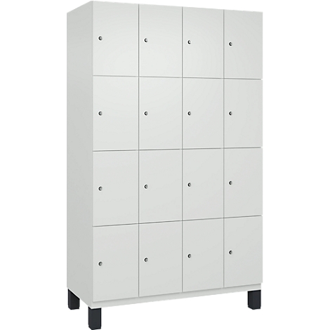 Armoire blanche avec 16 portes, chacune avec un bouton, reposant sur des pieds noirs.