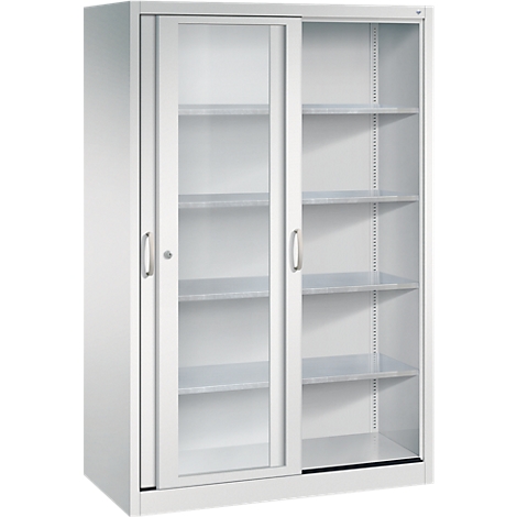 Une armoire métallique grise avec des portes coulissantes en verre et plusieurs étagères, sur fond neutre.