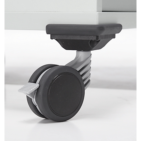 Gros plan d'une roulette : Roue noire avec levier de blocage sur un meuble gris.