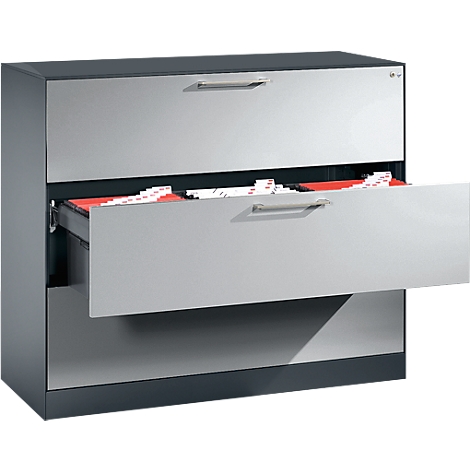 Gray metallic file cabinet with three drawers, one open showing red folders. Handle bars.