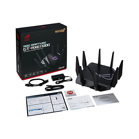 Schwarzer Router mit Antennen und ZubehÃ¶r vor weiÃŸem Hintergrund. Die Verpackung zeigt den Markennamen ROG Rapture GT-AXE11000.