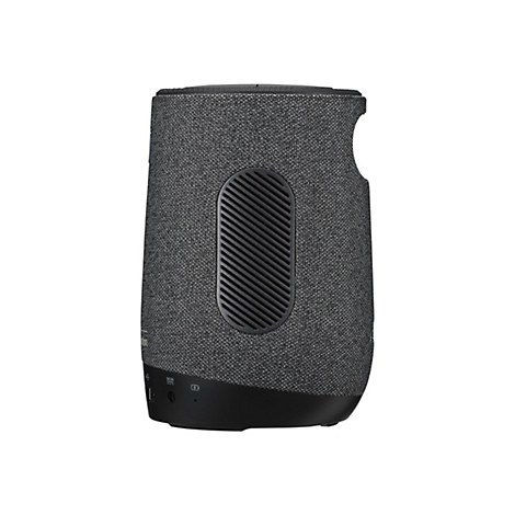 Ein zylindrischer Bluetooth-Lautsprecher in Grau und Schwarz. Er hat eine strukturierte Textiloberfläche, einen schwarzen Sockel und ein Lüftungsgitter.