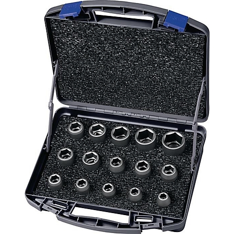 Mallette à outils ouverte avec différentes douilles. Mallette noire, inserts gris-noir pour l'outil.